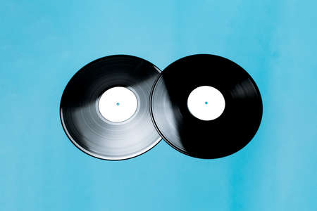 musical record on a blue background flat layの写真素材