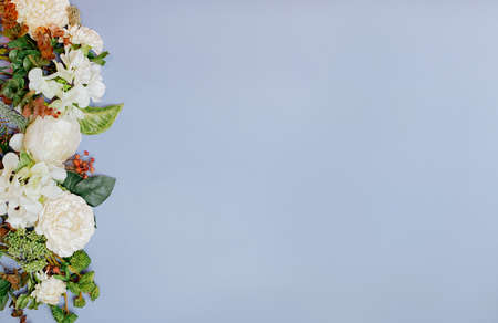 flowers and plants in the form of a frame on a lilac background frameの写真素材
