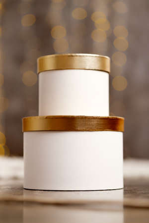 White christmas boxes with gifts on bokeh background. High quality photoの写真素材