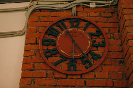Large analog metal clock in a shopping mall. High quality photoの写真素材