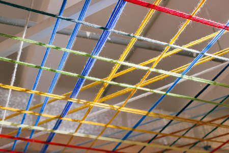 Interesting ceiling made of threads with lighting, exhibition decoration, art space decoration. High quality photoの写真素材