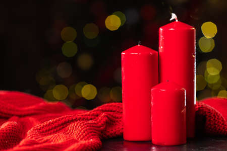 Red christmas candles on bokeh background. High quality photoの写真素材