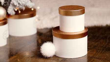 Gift boxes near the christmas tree on a bokeh background, new year holidays. High quality photoの写真素材