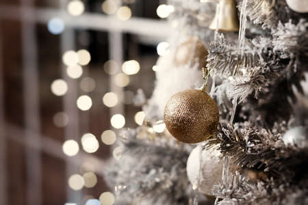 beautiful white Christmas decorations on a white tree, new year 2022, holiday. High quality photoの写真素材