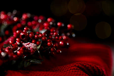 Christmas wreath with red berries on a dark background, christmas background. High quality photoの写真素材