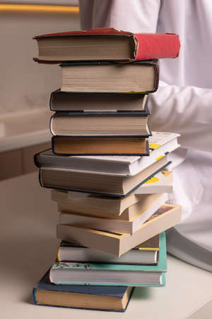 A stack of books on the table. High quality photoの写真素材