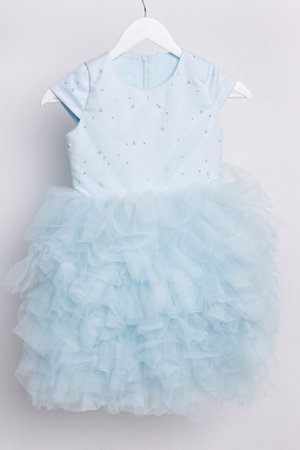 Dress for a girl - festive outfit on a hanger, ball gown for children. high quality photoの写真素材