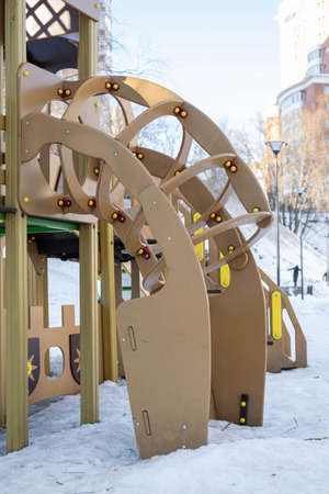 Children's playground in winter in the city. Children's slide, play equipment. high quality photoの写真素材