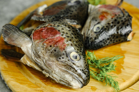 Fish heads on a wooden board