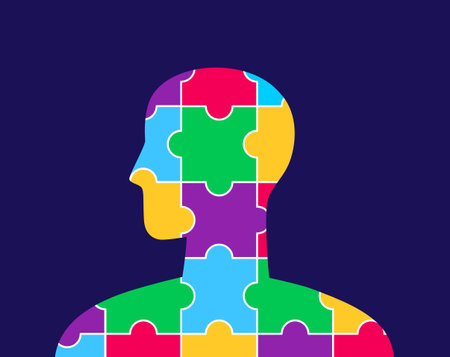 Human silhouette with a colorful puzzle pattern inside. World Autism Awareness Day. Vector illustration on a dark backgroundのイラスト素材