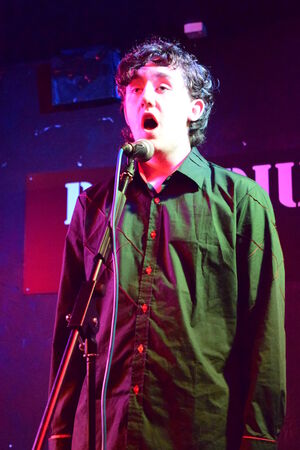 Teenager on stage singingの写真素材