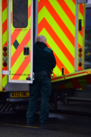 Paramedic getting equipment from the Ambulanceのeditorial素材