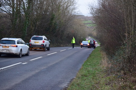 THE A39 is partially blocked after a two-car crash left oil and debris strewn across the road.  Police were called to the scene shortly after 3.30pm after receiving reports of a crash between a Peugeot 208 and Peugeot 106 near Fairy Cross.  PCSO Hannah Deのeditorial素材