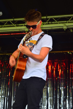 Ethan Young on stage at Bideford Summer fete in Bideford park 2014のeditorial素材