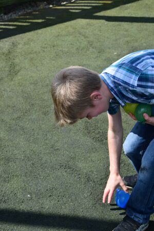 Young boys Have water fight with water bombsの写真素材