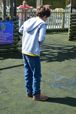 Young boys Have water fight with water bombsのeditorial素材