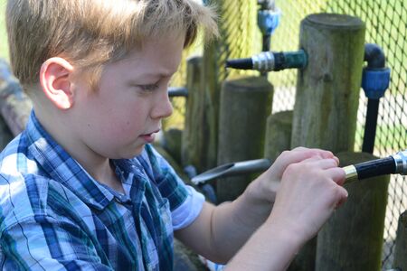 Young boys Have water fight with water bombsのeditorial素材