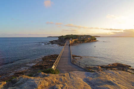 A view of bridge towards Bare Island, La Perouse, Sydney during golden hour before sunset.の写真素材