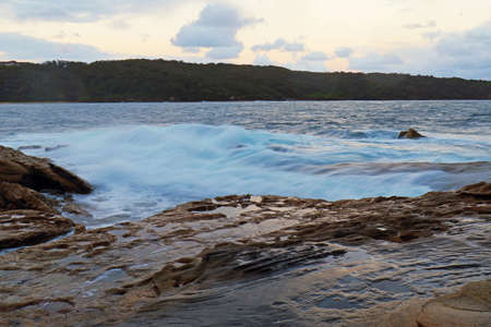 Water flow into rocks at La Perouse bay, Sydney, Australiaの写真素材