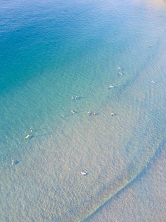 Aerial view of people paddle boarding at Freshwater Beach, Sydney, Australiaの写真素材