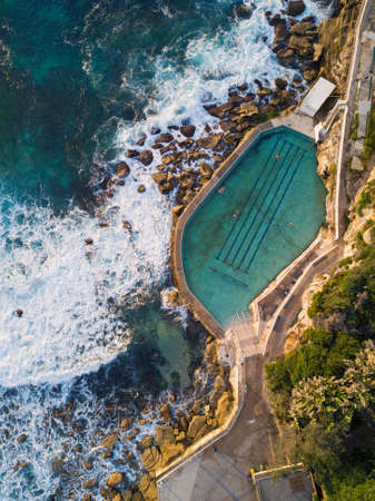 Aerial view of Bronte rock pool with incoming wavesの写真素材