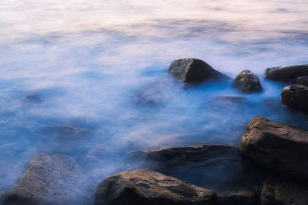 Long exposure ethereal look of water flowing over rocks.の写真素材