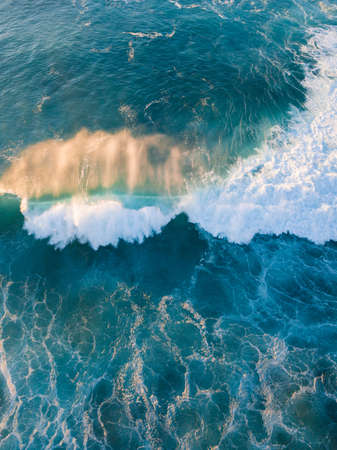Wave breaking in the morning top front view.の写真素材