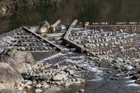 Stream of water flowing through rocks.の写真素材