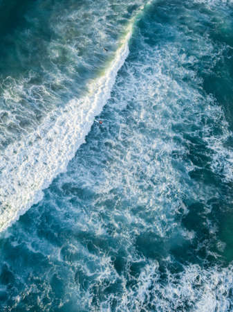 Aerial view of wave breaking.