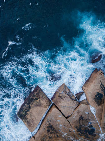 Aerial view of wave and rock.の写真素材