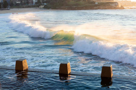 Incoming waves towards the rock pool.の写真素材