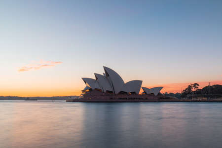 Sydney, Australia - July 19, 2018: Sydney Opera House view just after sunrise with clear sky.