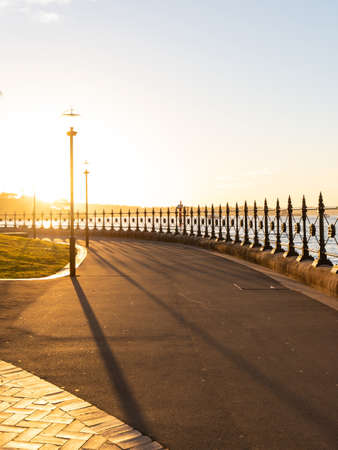 Sunshine on a side walk near the harbour.の写真素材