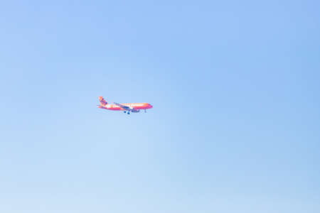 Sydney, Australia - July 21, 2018: Jetstar plane flying in a clear blue sky.のeditorial素材