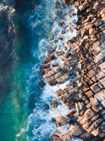 Aerial view of rock in the coastline.の写真素材