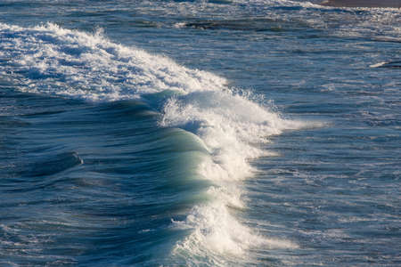 Incoming shallow wave on the beach.の写真素材