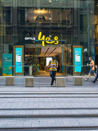 Sydney, Australia - November 1, 2018: One person standing in front of Optus shop at George St.のeditorial素材