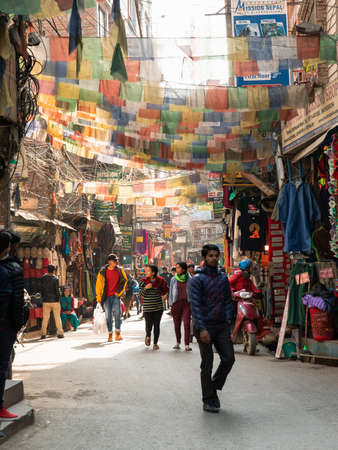 Kathmandu, Nepal - December 6, 2018: Crowd of people at busy market street of Thamel in the day.のeditorial素材