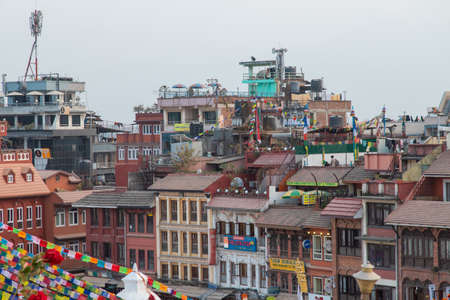 Kathmandu, Nepal - December 7, 2018: Buildings around Boudhanath Stupa area with cloudy sky.のeditorial素材
