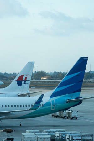Jakarta, Indonesia - January 7, 2019: Garuda Indonesia and Malaysia Airlines airplane tail view.のeditorial素材