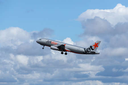 Sydney, Australia - March 20, 2019: Jetstar Airbus A320 takes off to a cloudy sky. Registration VH-VQAのeditorial素材