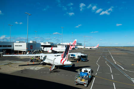 Sydney, Australia - May 11, 2019: Virgin Australia planes parked at Sydney airport tarmac.のeditorial素材