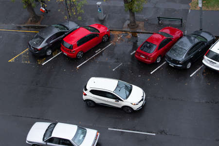 Adelaide, Australia - May 11, 2019: Top view of car parking and driving through on the road.のeditorial素材