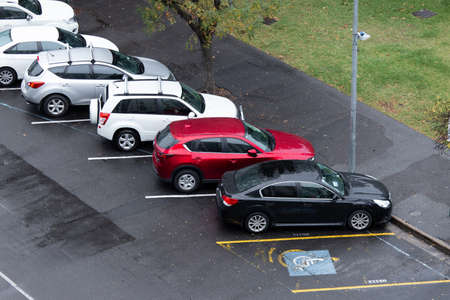 Adelaide, Australia - May 11, 2019: Top view of car parked in angled parking on the road side.のeditorial素材