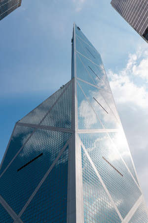 Hong Kong - October 4, 2019: Bank of China Tower look up view with blue sky.のeditorial素材
