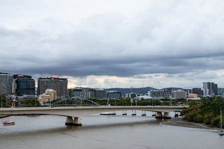Brisbane, Australia - January 25, 2020: Cloudy sky over the South Bank skyline and bridges.