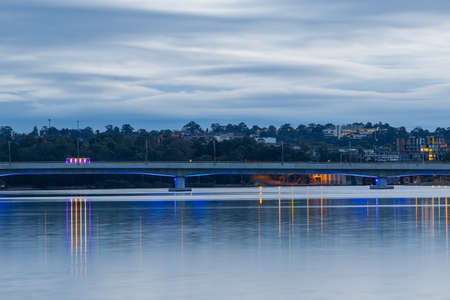 Bridge with blue light underneath at Homebush Bay, Sydney, Australia.の写真素材