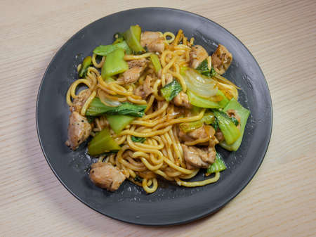 A plate of chicken and vegetable yakisoba (fried noodle).の写真素材