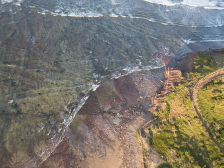 Aerial view of headland around the beach.