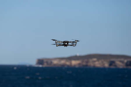 Sydney, Australia - July 4, 2020: DJI Mavic Pro drone flying above the water.のeditorial素材